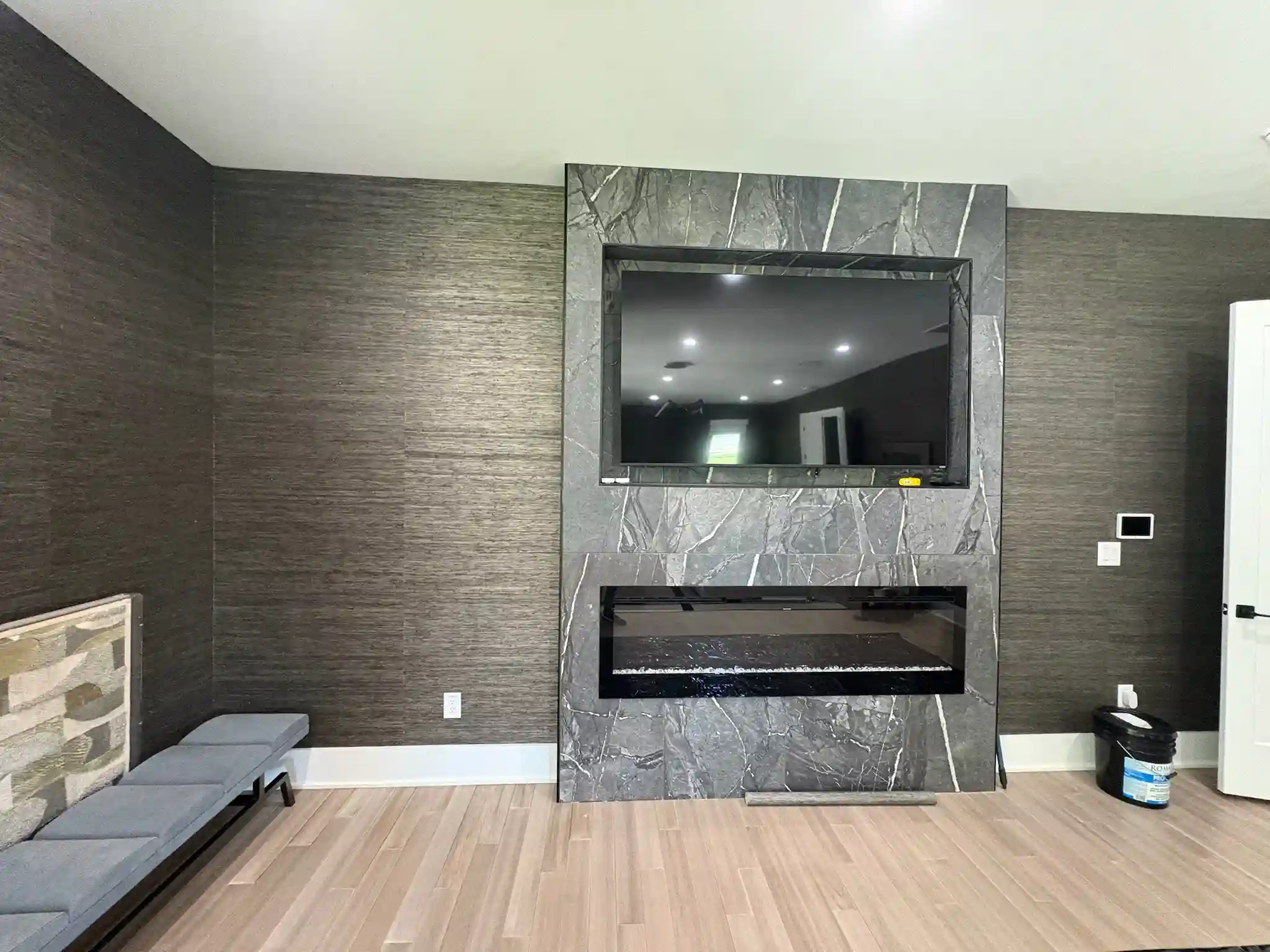 Luxury grasscloth wallpaper installation in Dallas home